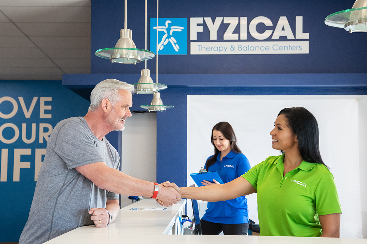 Patient and CCS Shaking Hands FYZICAL Bon Air