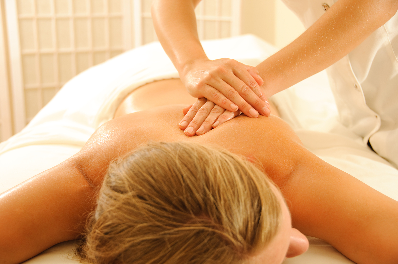 massage therapist relieves back pain in Katy, TX