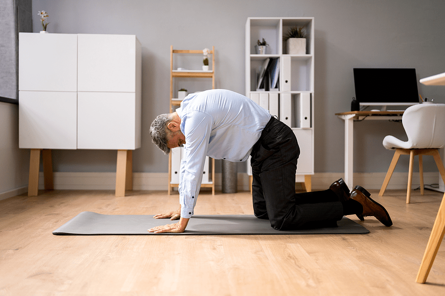 Man performing Cat/Cow Stretch for Lower Back Pain