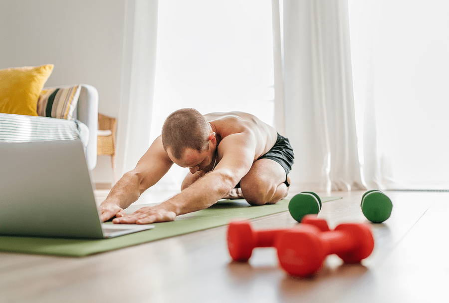 Man performing Child’s Pose stretch for Lower Back Pain