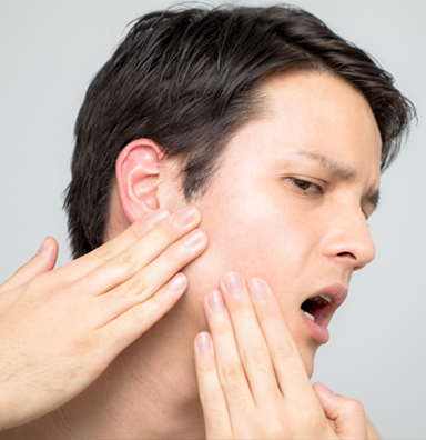 Women checking suffering from TMJ checks her jaw joints